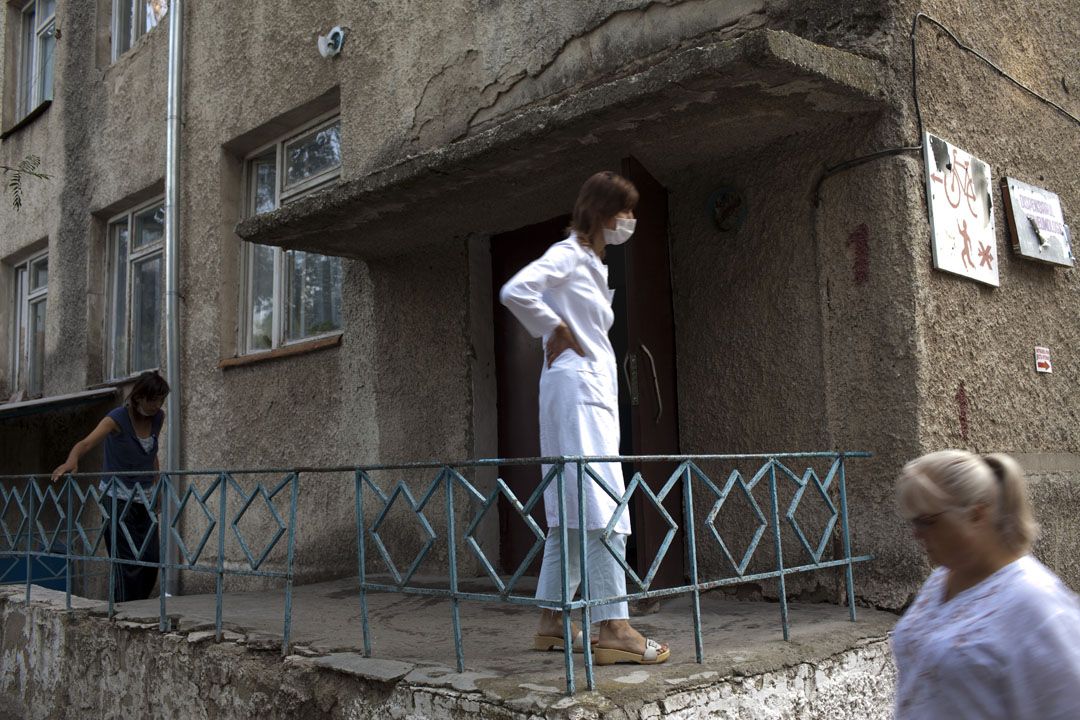 Staff and patients walk outside of the main Tuberculosis hospital in Balti, Moldova.