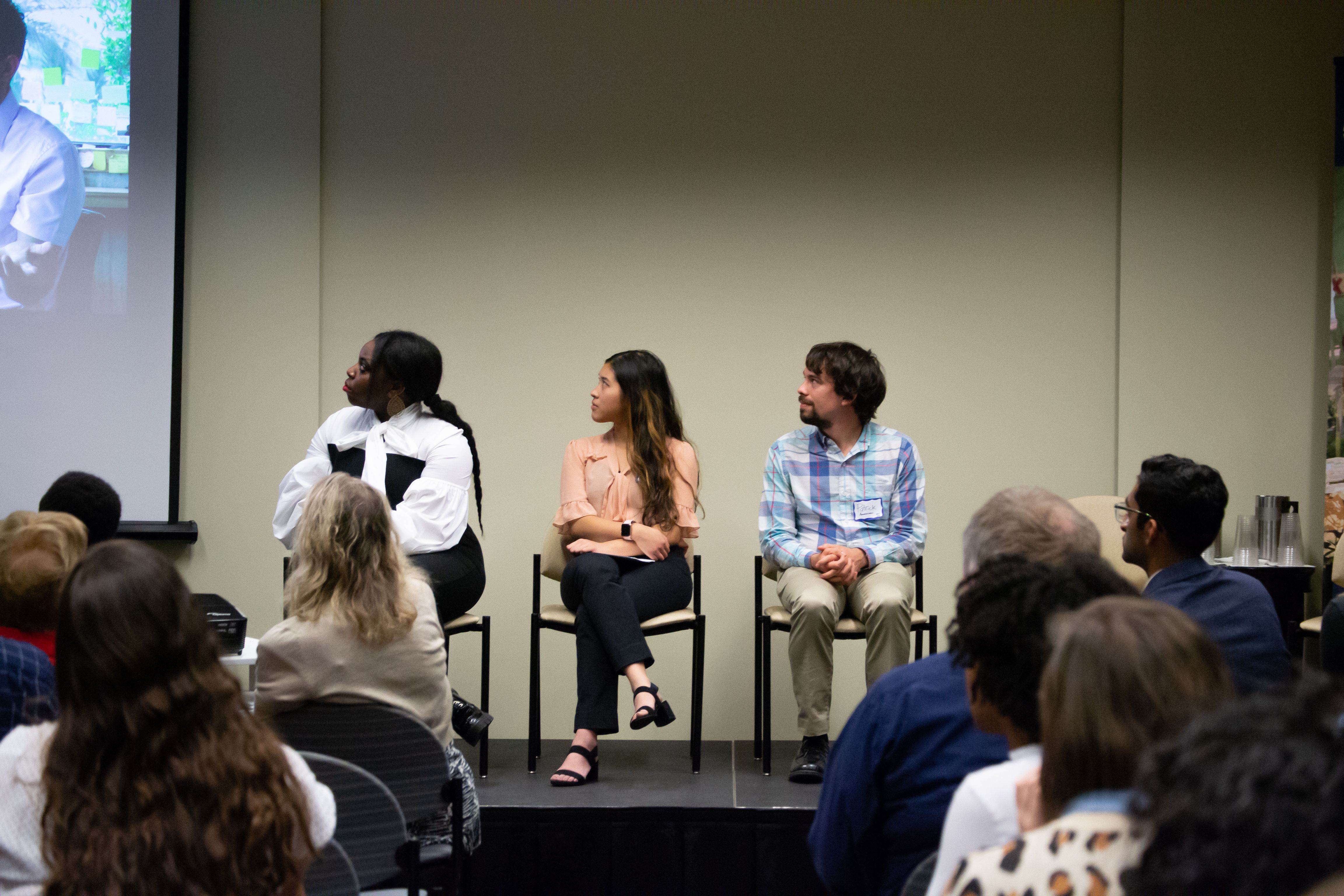 Angelica Ekeke (UC Berkeley Graduate School of Journalism), Micah Castelo (Syracuse University), and Patrick Ammerman (University of Pennsylvania) on stage during the Migration and Displacement panel. Image by Nora Moraga-Lewy. United States, 2019.