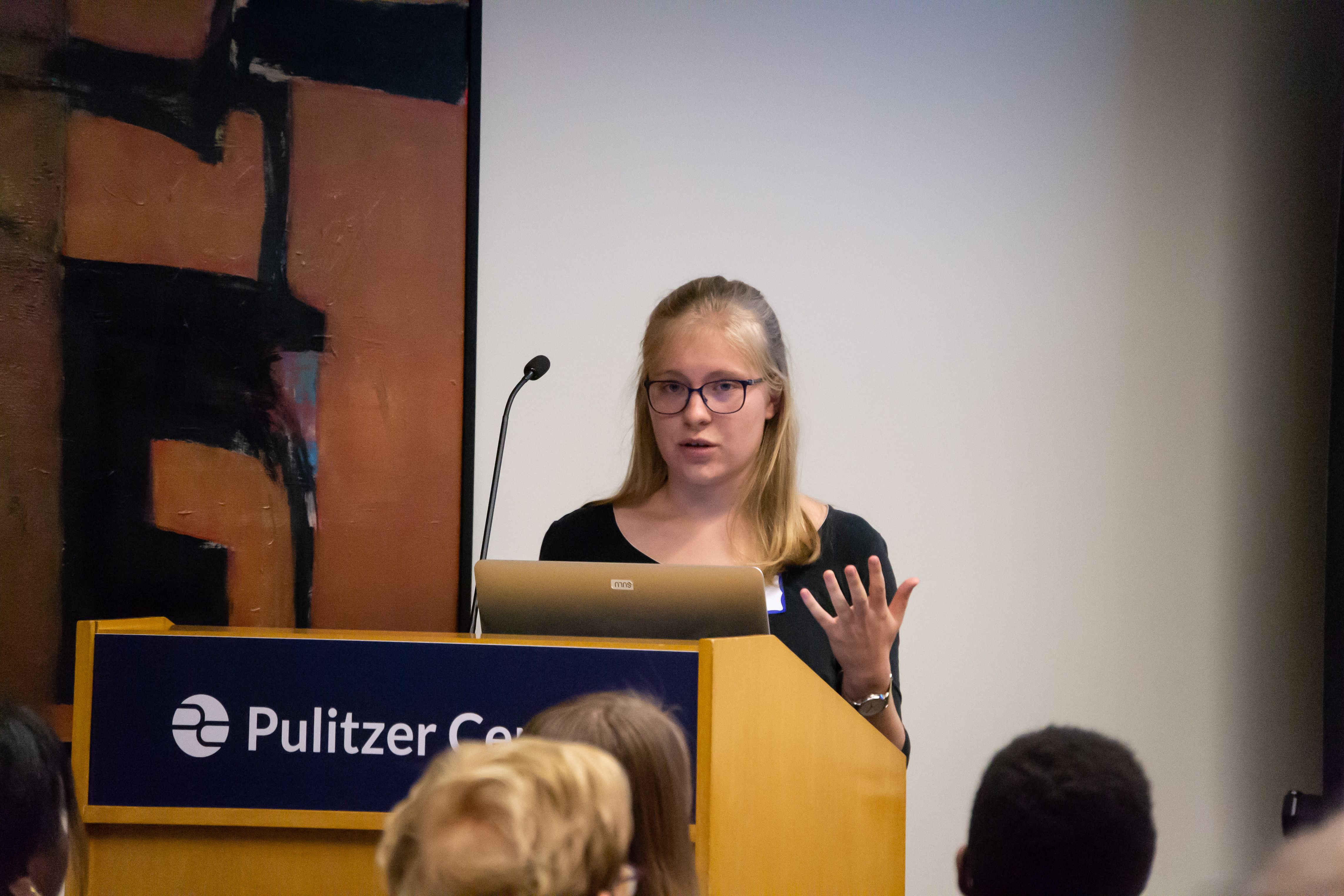 Lily Moore-Eissenberg (Yale University) discusses her project "Borderland Sisterhood" during the "Impact of Religion" panel on Day One of Washington Weekend. Image by Nora Moraga-Lewy. United States, 2019.