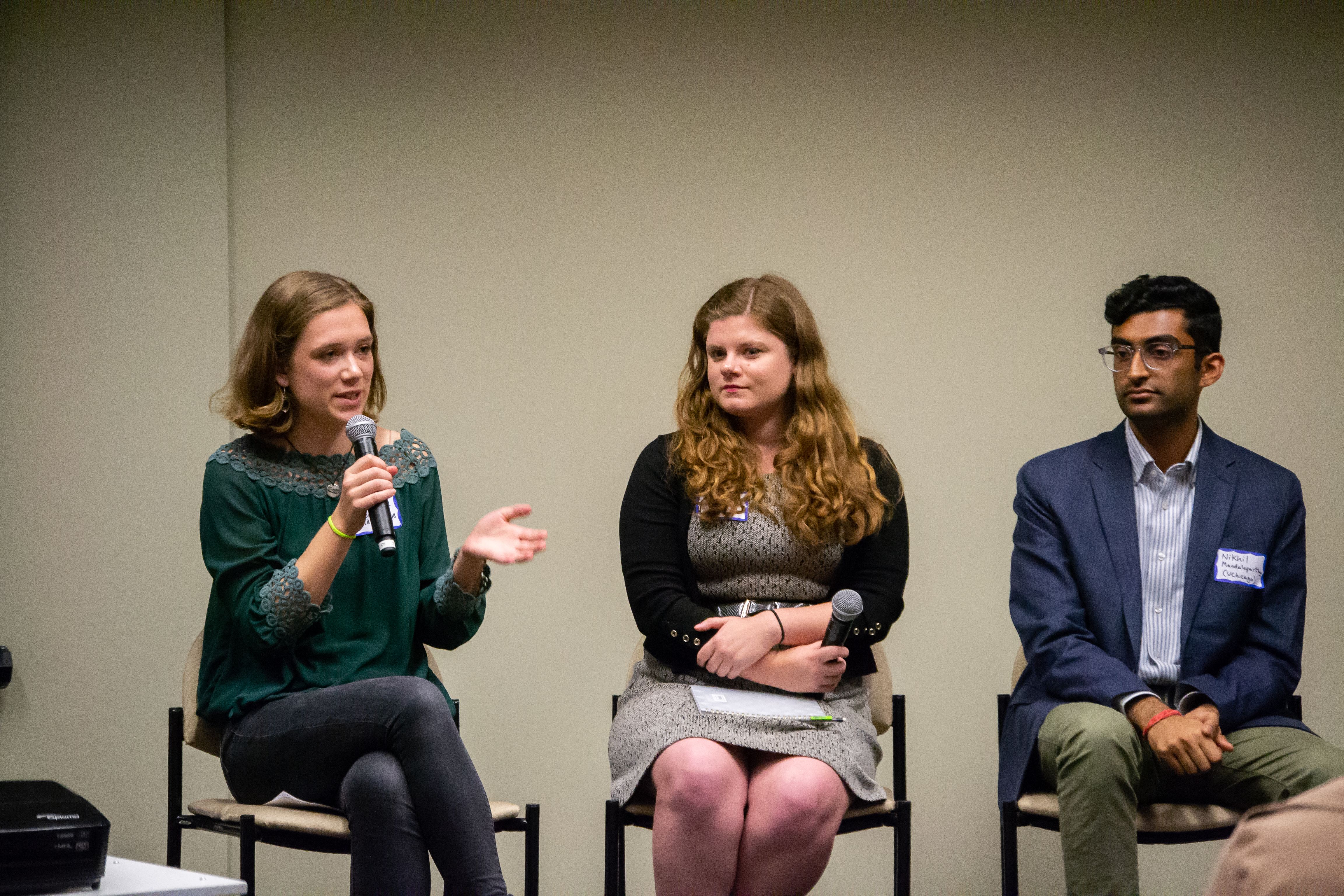 Catherine Cartier (Davidson College) responds to an audience question during the "Impact of Religion" Q&A session alongside fellow panelists Kaitlyn Johnson (Georgetown University) and Nikhil Mandalaparthy (University of Chicago). Image by Nora Moraga-Lewy. United States, 2019.