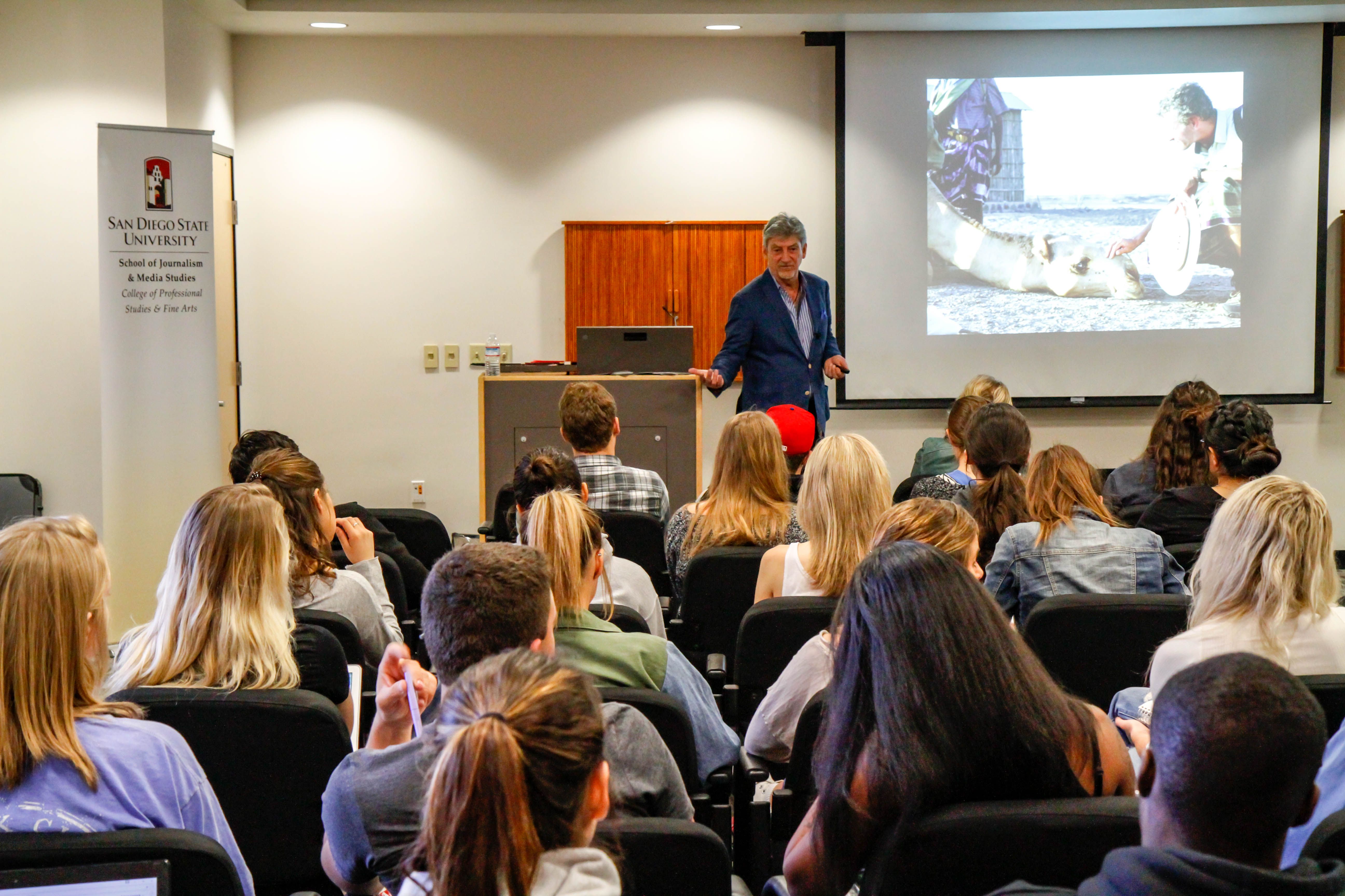 At San Diego State University, Don Belt speaks a room of 80 people, including faculty, students and the local public about his journey to National Geographic and his work with building curriculum and workshops using lessons from Paul Salopek's Out of Eden Walk. Image by Lauren Shepherd. United States, 2017.