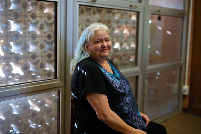 Anna Koski sits in the Miami public library. She says the day Elizabeth went to prison was, “the worst day of my life.” Her daughter, Elizabeth Crafton is 13 years into a 20 year sentence for enabling child abuse. Her live-in boyfriend Chris Good was convicted of abusing her young daughter but only received an 11 year sentence. Photo by Destiny Green. United States, 2020.