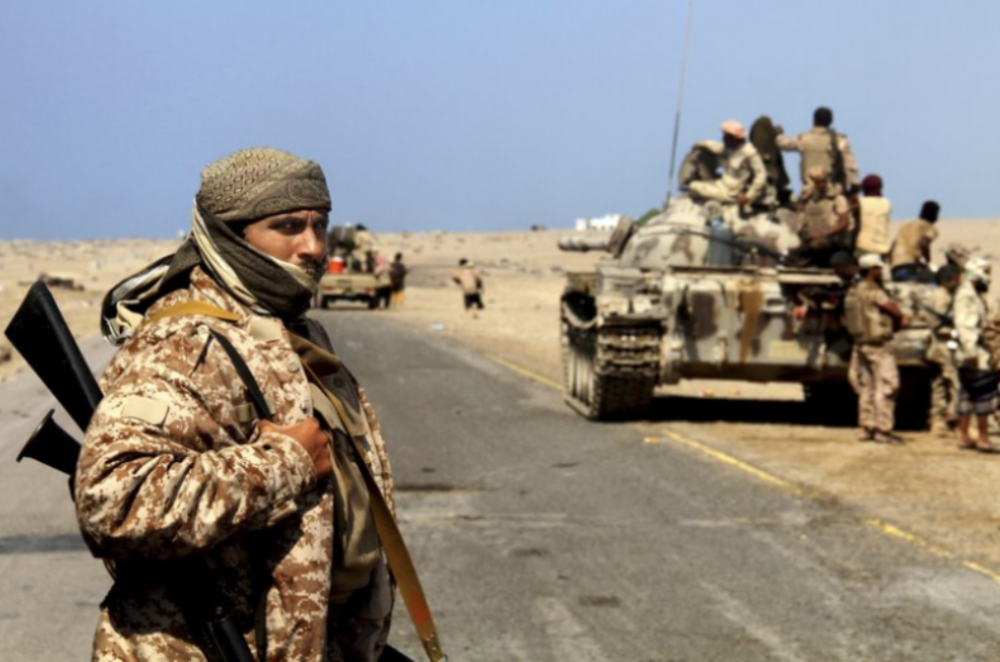 Coalition-backed fighters advance on Yemen’s Red Sea port town of Mocha in this Jan. 11 2017, photo. The coalition forces eventually captured the town from Shiite rebels known as Houthis. Some fighters in the unit were openly al-Qaida, wearing Afghan-style garb and carrying weapons with an al-Qaida logo, a sign of how closely the militants have been involved in the war against the Houthis, who are seen by Saudi Arabia and the United Arab Emirates as a proxy for Iranian influence. Image by AP. Yemen, 2017.