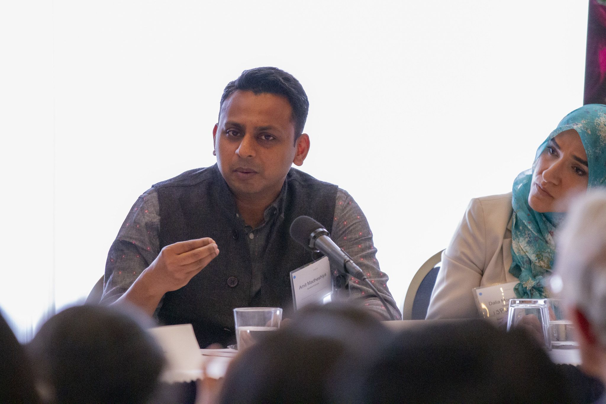 Filmmaker Amit Madheshiya explains the subject of his film, “The Hour of Lynching,” at the “Beyond Religion” conference. Image by Jin Ding. Washington, D.C., 2019.
