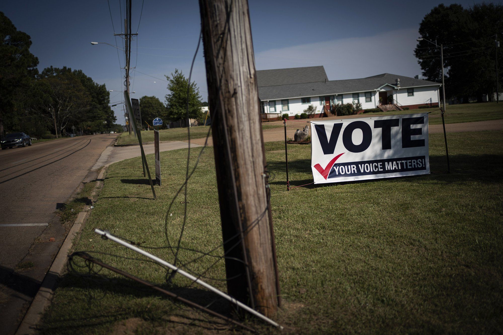 A banner urging citizens to vote is displayed on the side of a street in Jackson Miss. Image by Wong Maye-E / The Associated Press.