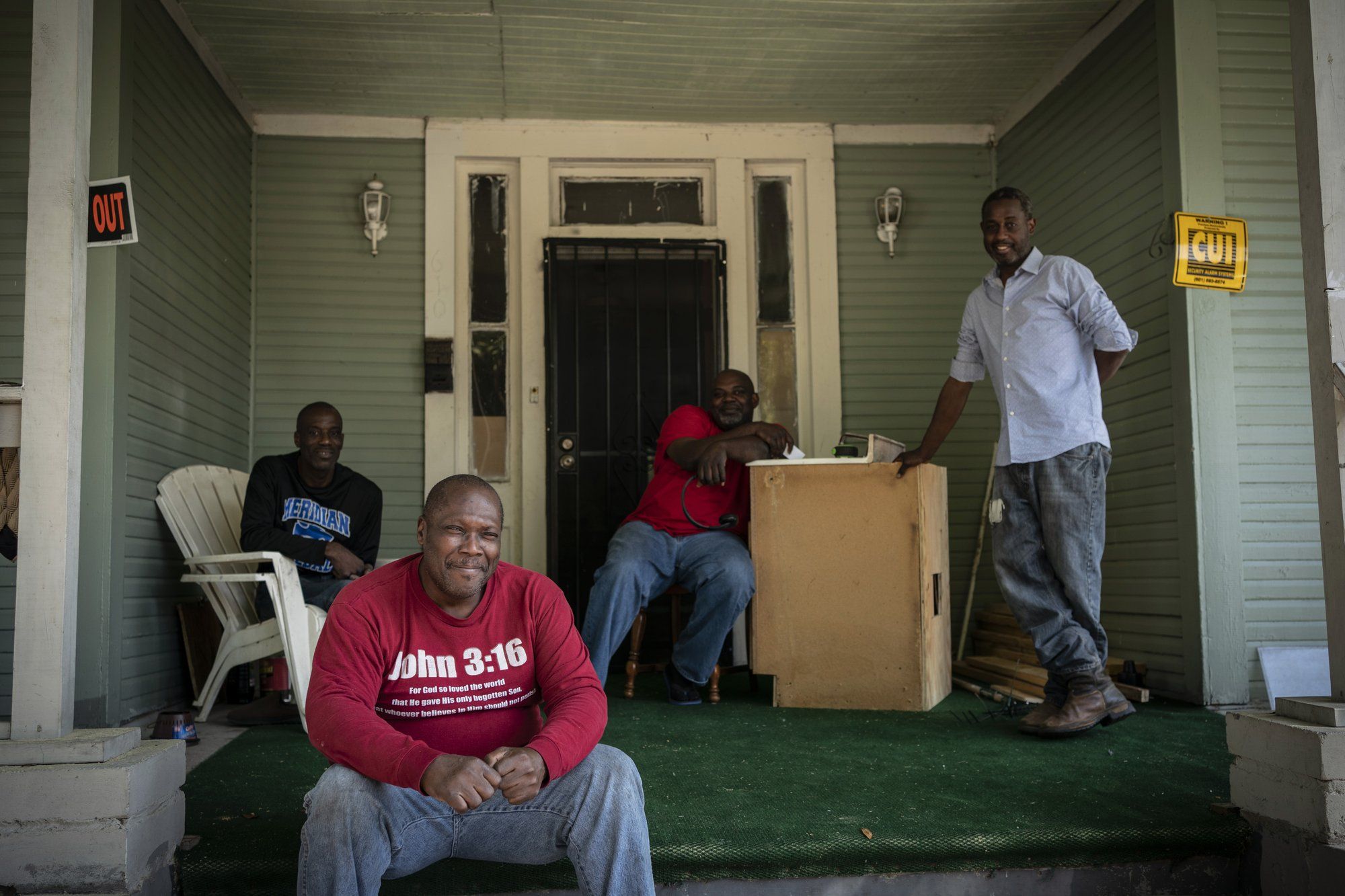 Pictured from left to right, Gregory Blanchard, 53, Clyde Lewis, 59, Tommy McCoy, 48, and Anthony Boggan, 49, pose for a group portrait on McCoy's front porch, in Meridian, Miss. Image by Wong Maye-E / The Associated Press. United States, 2020.