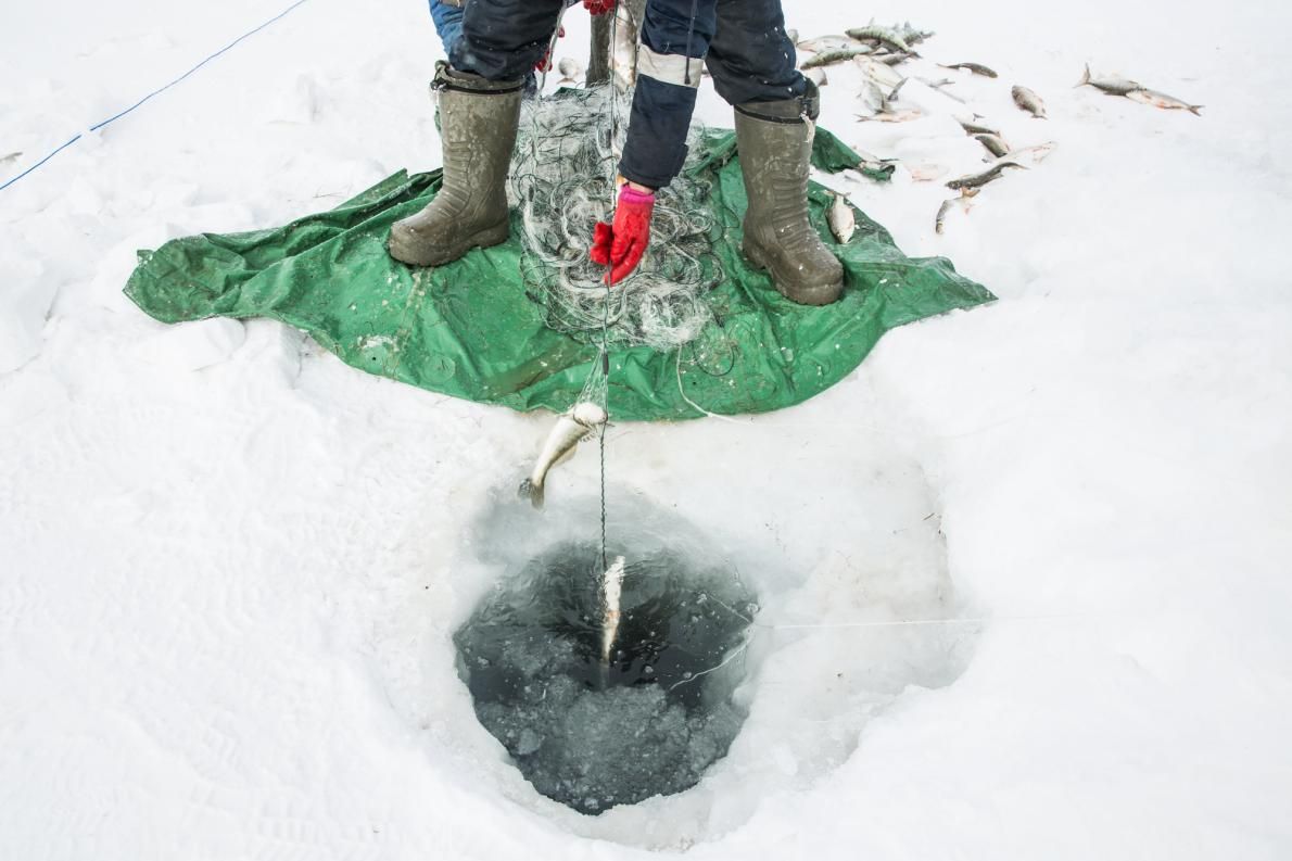 Ice fishing can be cold, yet lucrative, work. Image Taylor Weidman. Kazakhstan, 2017.