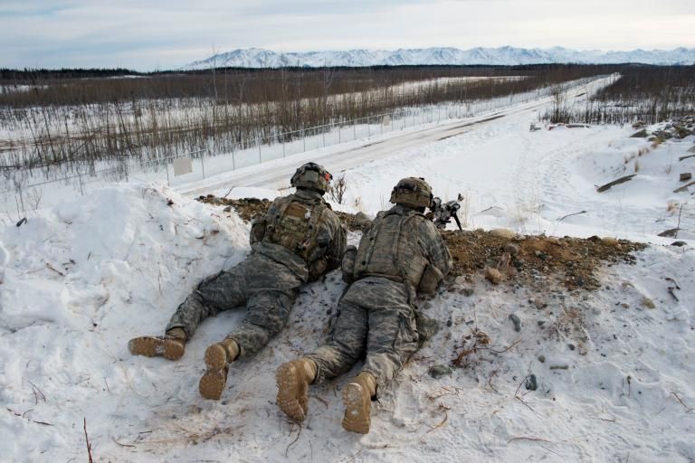U.S. Army troops practice defensive tactics at Fort Greely, Alaska. The fort is a launch site for interceptor missiles that are designed to shoot down incoming ballistic missiles—like those North Korea has said it now possesses. Image by Louie Palu. United States, 2018.