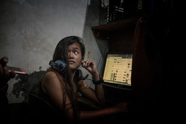 Durana posts photos of her late husband on social media. Image by James Whitlow Delano. Philippines, 2018. 