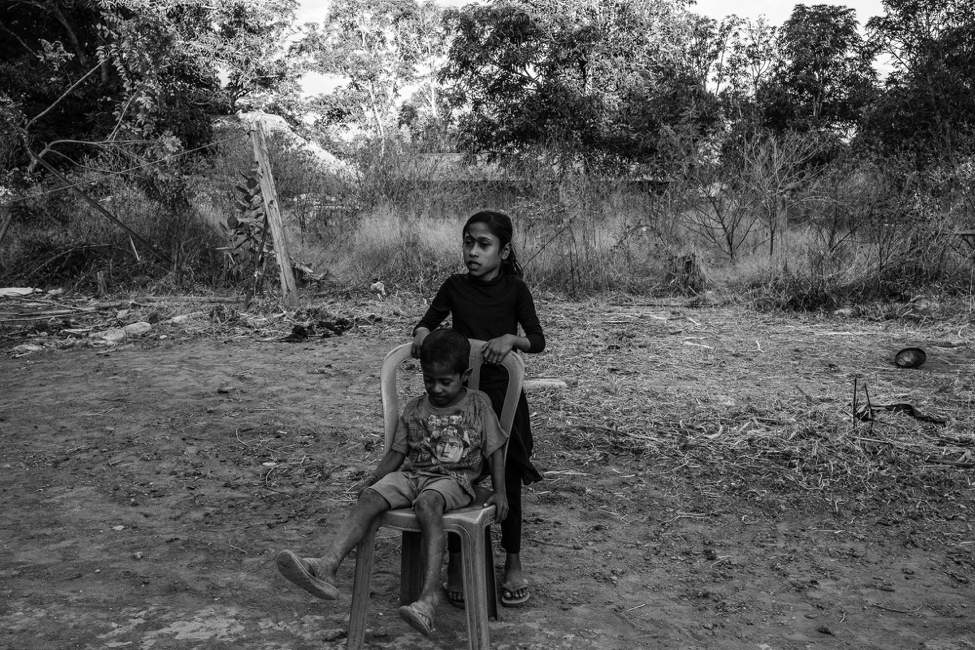The first time that Dolfina called home, her father later recounted, she said that her employers were good to her and she would send money soon. The money would help support her parents’ failing farm, and her young son and daughter (pictured). Image by Xyza Cruz Bacani. Indonesia, undated.
