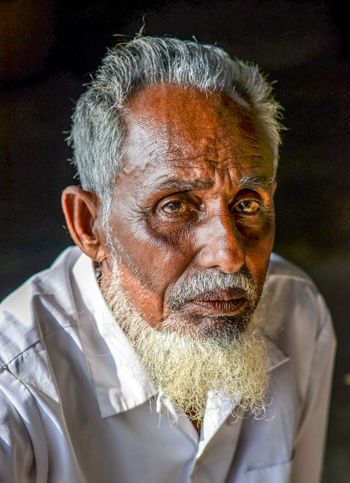 Polder 32 resident Jaharul Sardar, who narrowly escaped a 2009 flood, remembers when the walls ringing his home kept him safe. Image by Tanmoy Bhaduri. Bangladesh, 2017.