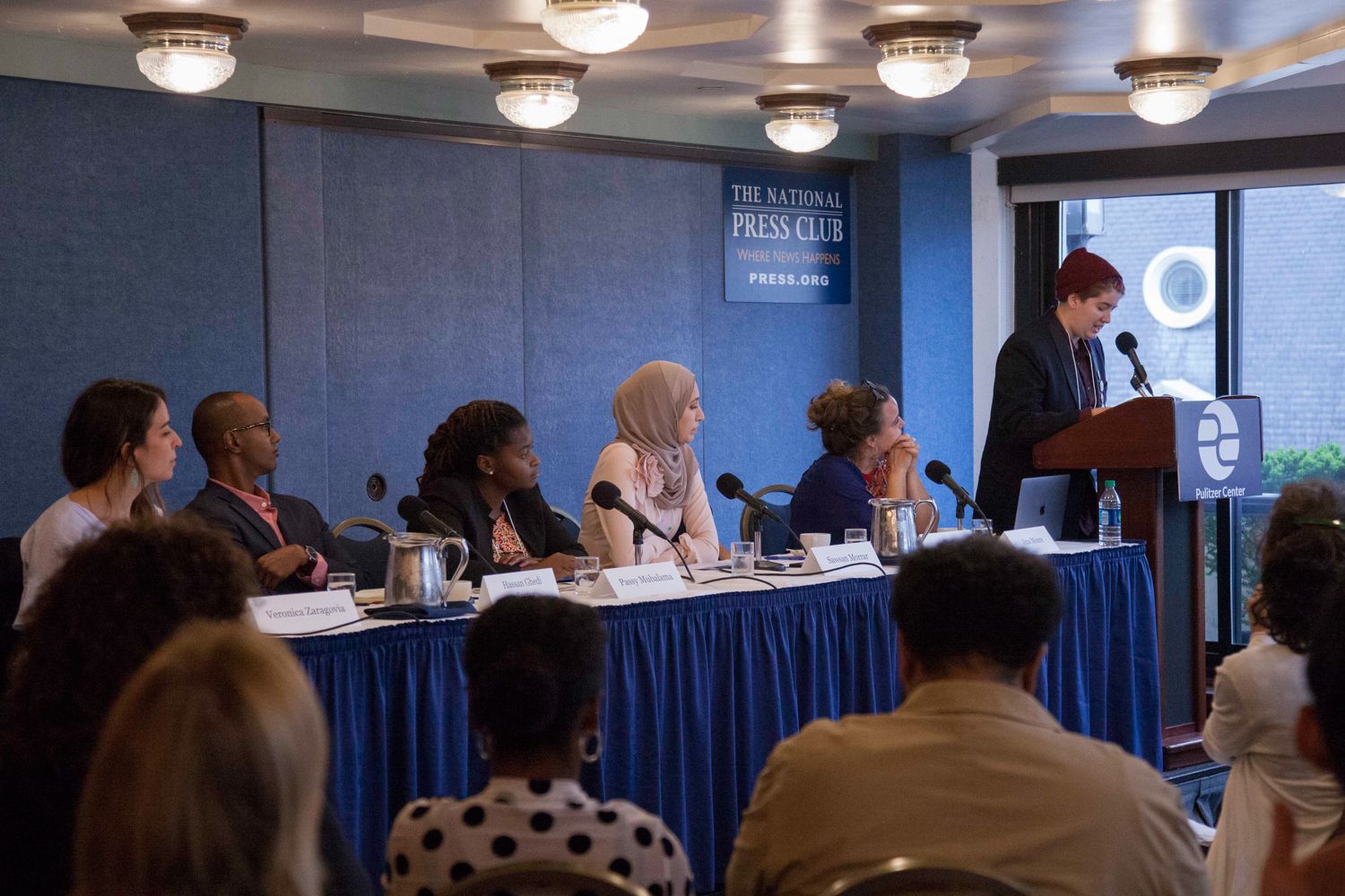 Pulitzer Center Fighting Words Poetry Contest 1st place winner Alex Holland, 11th grade student at Montgomery Blair High School, MD, reads "Sickness of the Sprawling City" before the "From the Ground Up: Building Peace Outside the Halls of Power" panel at the Beyond War conference. Image by Jin Ding. Washington, D.C., 2018.