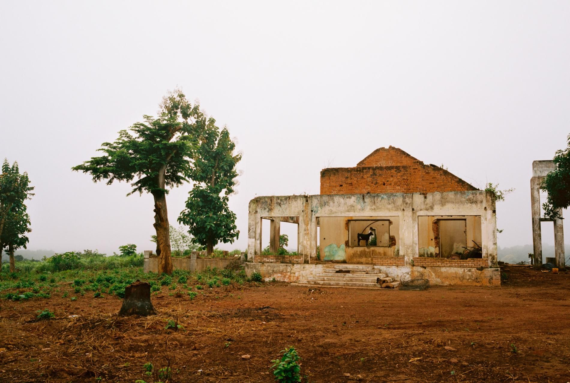 The destruction of many administrative buildings in the towns occupied by the Seleka—including the prefect’s residence in Bambari (left)—has hindered the rebuilding of shattered communities. But the biggest challenge in many places is coaxing frightened residents to return. The mayor of Bangui’s PK12 district, Jean Emmanuel Gazanguenza (right), has encouraged Muslims and Christians to return. So far no Muslims have done so. Image by Marcus Bleasdale. Central African Republic.