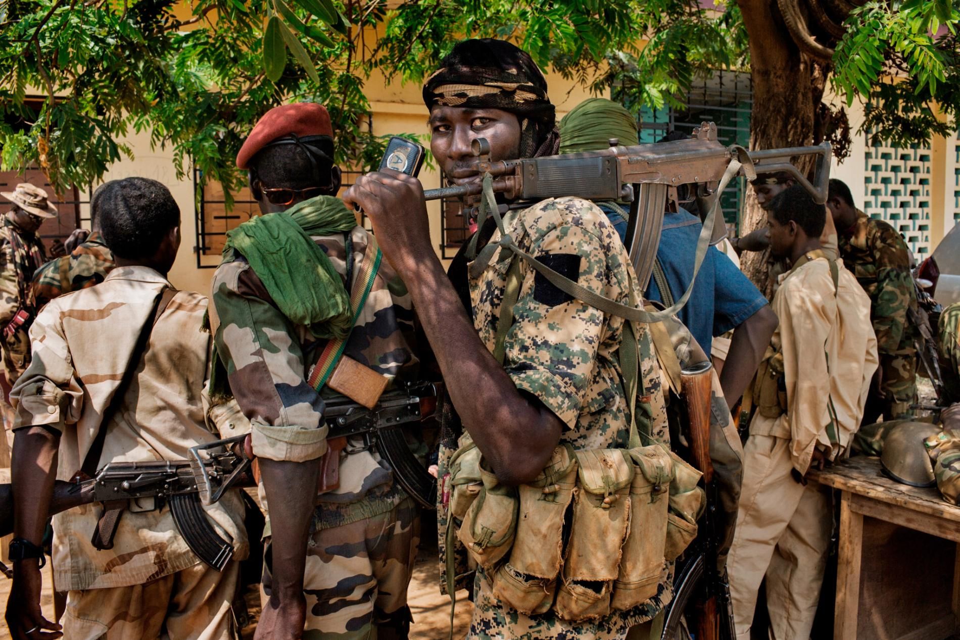 Although religion has little to do with how the conflict started, the violence has since divided the country along religious lines. Rebel groups calling themselves the Seleka (left), composed mostly of Muslims from the north, toppled the government in 2013. The Seleka’s brutal treatment of Christian and animist civilians led to the rise of the Anti-Balaka (right), local militias formed to drive the Seleka out of their towns and villages. Image by Markus Bleasdale. Central African Republic.