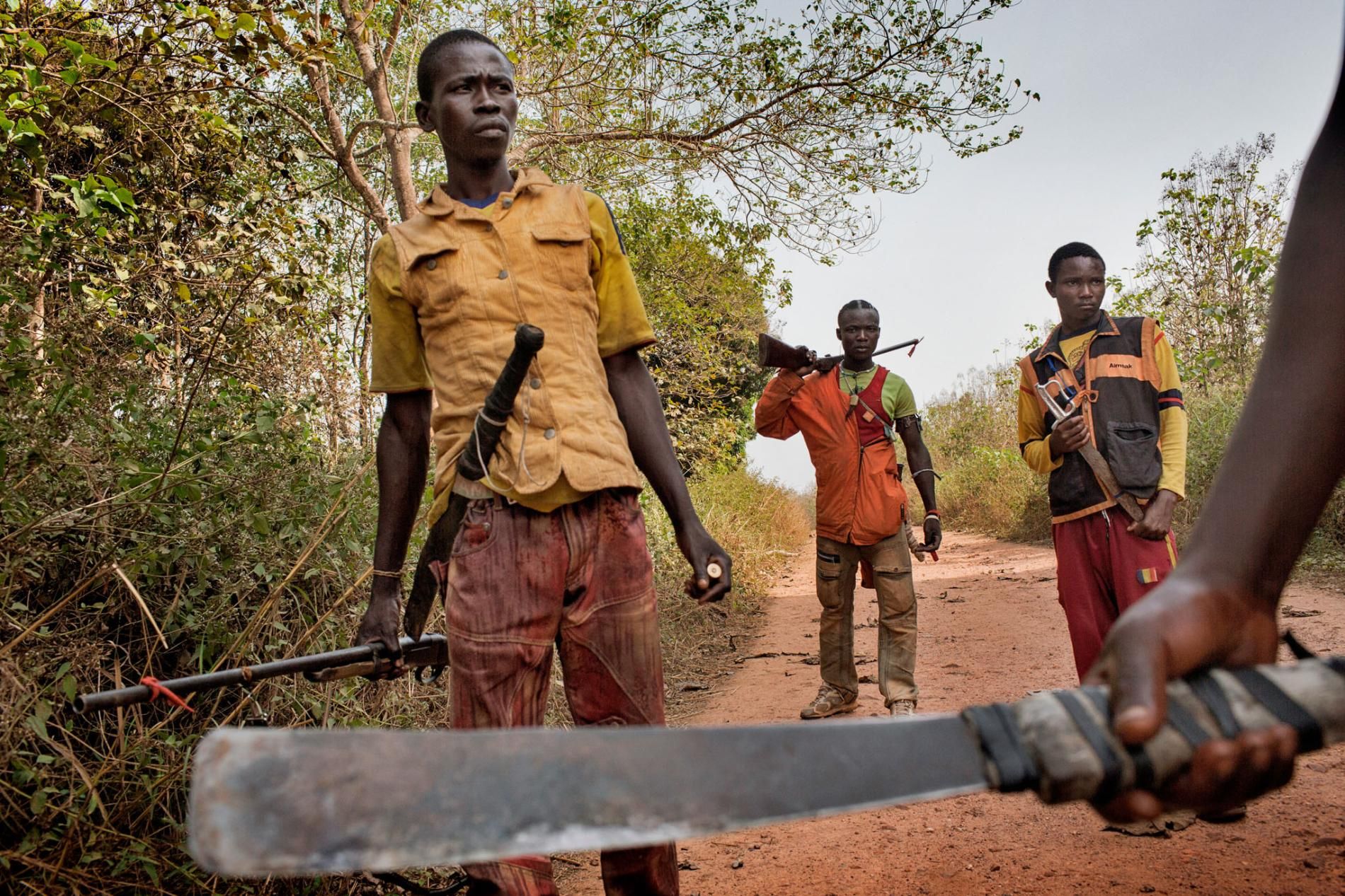 Although religion has little to do with how the conflict started, the violence has since divided the country along religious lines. Rebel groups calling themselves the Seleka (left), composed mostly of Muslims from the north, toppled the government in 2013. The Seleka’s brutal treatment of Christian and animist civilians led to the rise of the Anti-Balaka (right), local militias formed to drive the Seleka out of their towns and villages. Image by Markus Bleasdale. Central African Republic. 