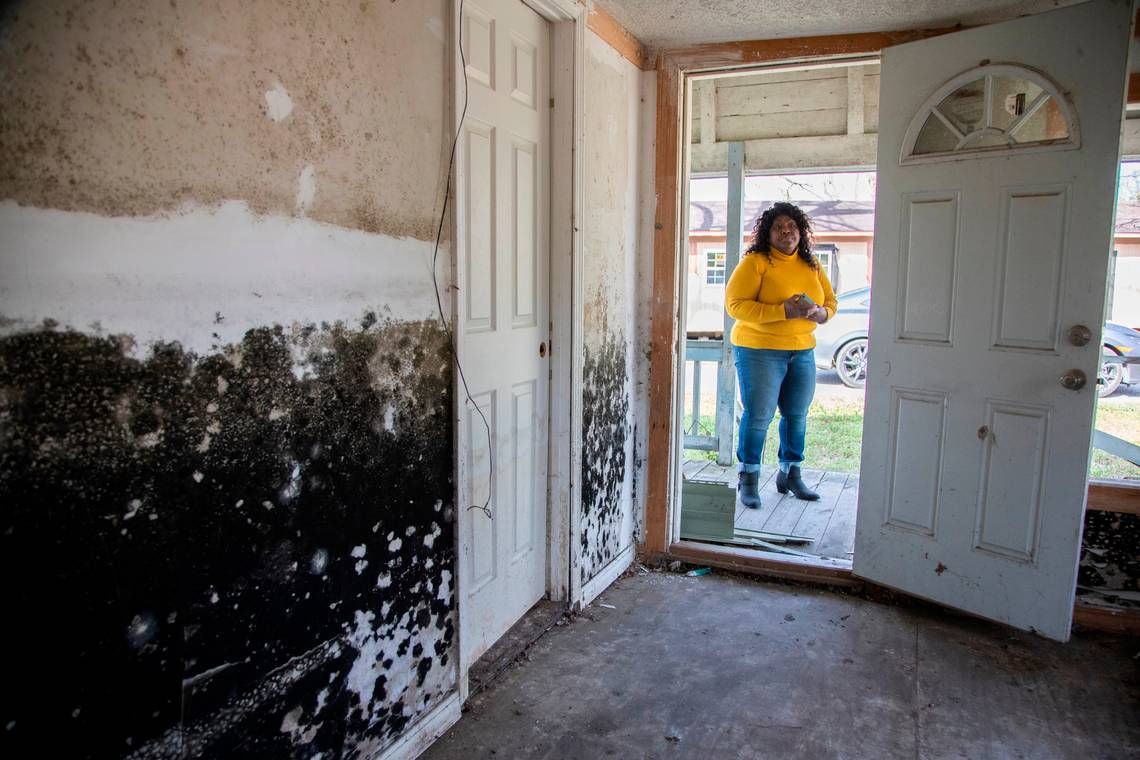 Sellers, South Carolina. Mayor Barbara Hopkins shows homes damaged by repeated flooding and hurricanes on February 13, 2020. While many homeowners across the small town have received help from FEMA and other natural disaster response agencies, those without a clear title for their home have been left with no government help in mold saturated homes. Image by Joshua Boucher. United States, 2020.