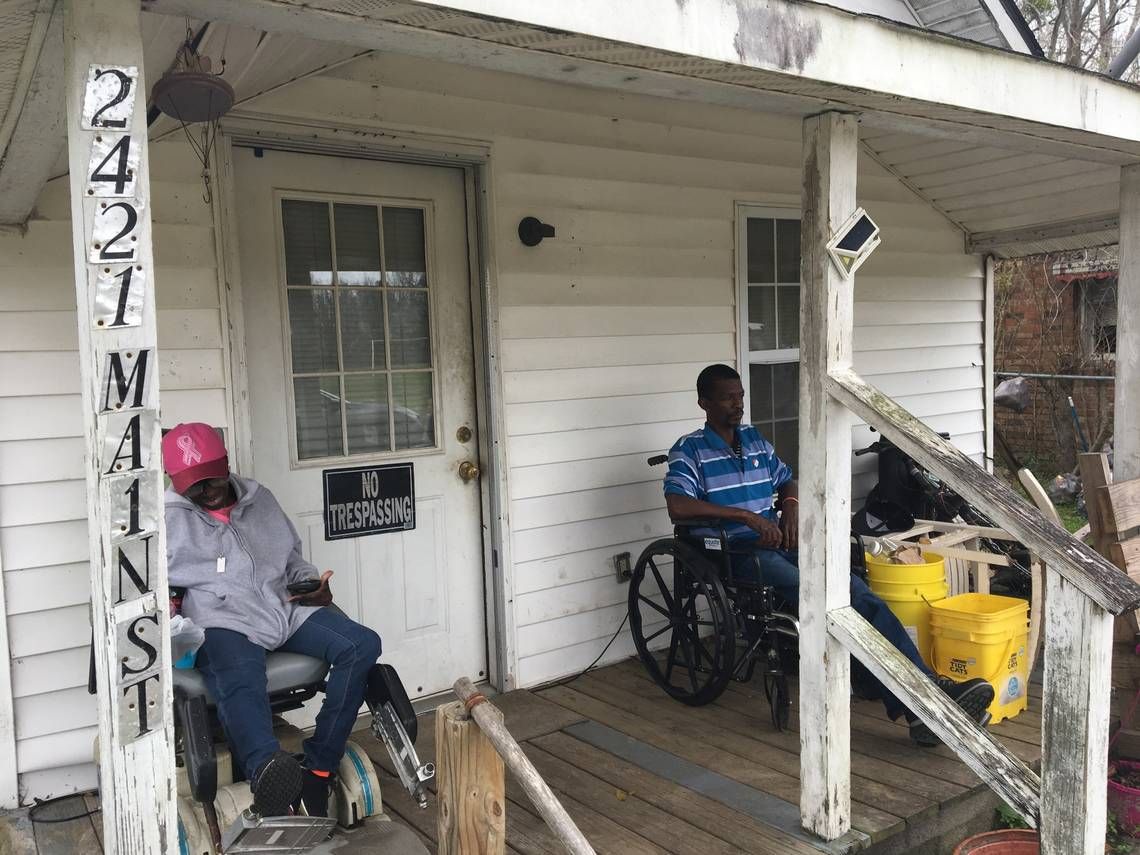 Mold has overwhelmed parts of Sellers, SC, causing people like these residents to flee their homes and seek shelter with friends. Repeat floods are blamed for the mold problems. Image by Sammy Fretwell/The State. United States, undated.