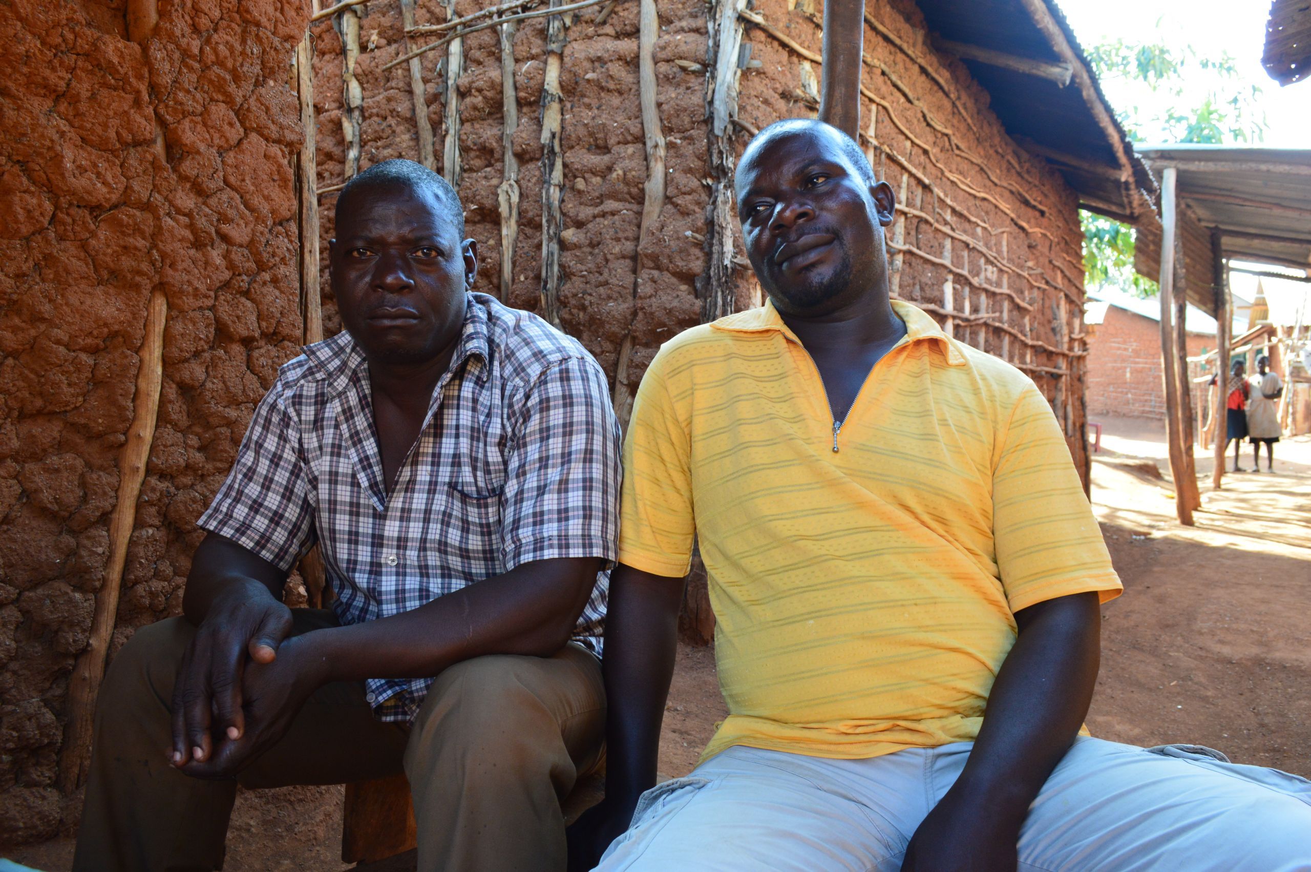 Joseph Kivumbi Kizza, the Namugongo chairman, with another village member. Image by Annika McGinnis. Uganda, 2019.