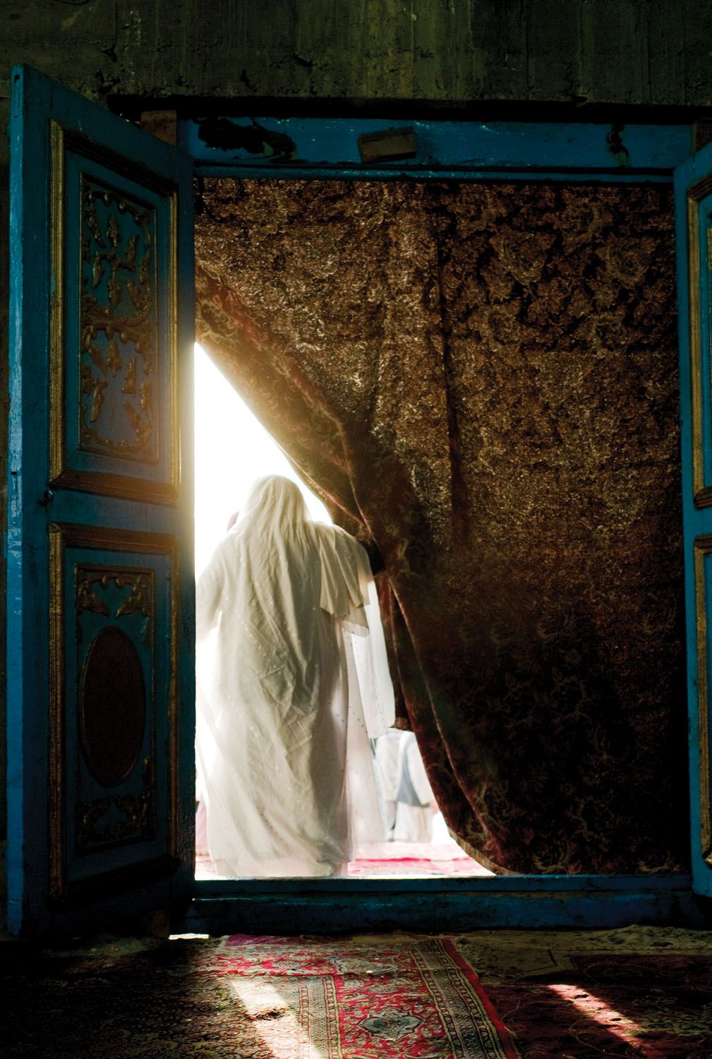 A Sufi shrine at a mosque frequented by Hazara, often the target of Daesh and Taliban attacks. Image by Monika Bulaj. Afghanistan, 2010.