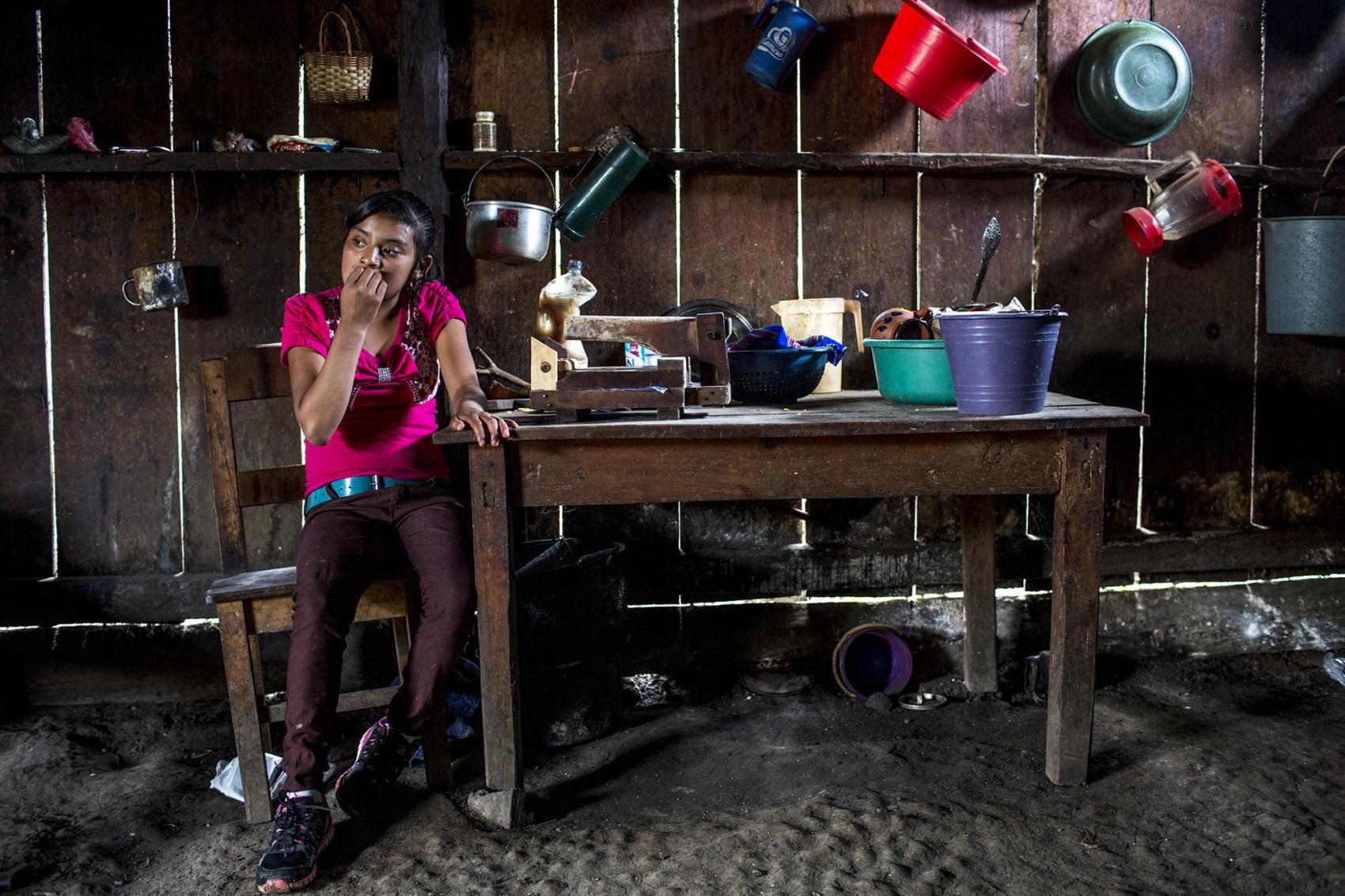 Candelaria López, 15, at home in Yalambojoch, stays at home to help raise her siblings. She no longer goes to school because her family can’t afford to pay the $60 school fee. Image by Simone Dalmasso / The Arizona Daily Star. Guatemala, 2019.
