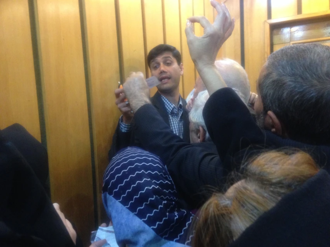 Parliamentary candidate Sayed Miaad Salehi is mobbed by supporters. Image courtesy of Reese Erlich. Iran, 2020.