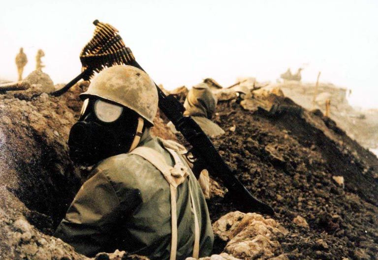 An Iranian soldier wearing a gas mask during the Iran-Iraq War. In the waning days of the war, Iraq resorted more frequently to bombarding soldiers and civilians with sulfur mustard and nerve agents. Image licensed under CC BY-SA 3.0.