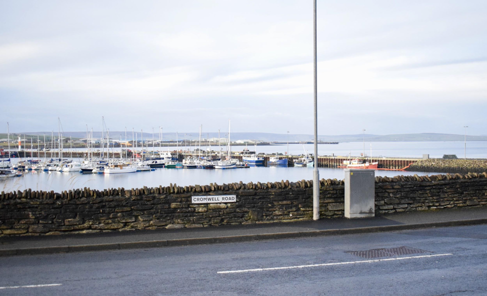 Cromwell Road, near the Kirkwall Marina. Kirkwall is one of the two main cities on the Orkney mainland. Like Stromness, the other city, Kirkwall is a harbor town. Image by Maggie More. United Kingdom, 2020.
