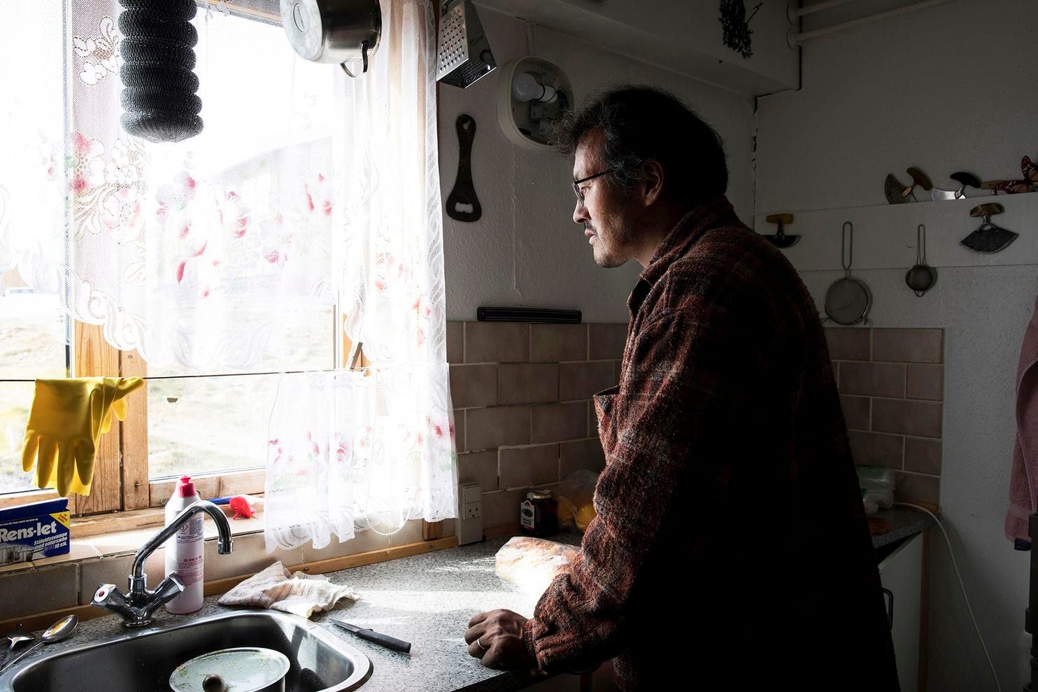 Orla Kleist, who lives in Qaanaaq, says his house has been damaged repeatedly over the years by changes in the permafrost. Image by Anna Filipova. Greenland, 2019.