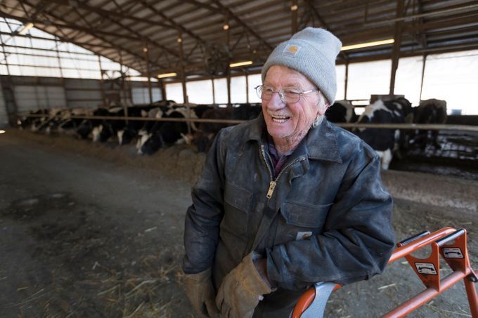 Still recovering from a stroke, Chuck Spaulding takes a break while doing chores. The Spauldings have partnered with their daughter and her husband to run the farm, S & S Dairy. Like most dairy farmers they are struggling to make ends meet because of milk prices that do not cover expenses. Image by Mark Hoffman/The Milwaukee Journal Sentinel. USA, 2019.