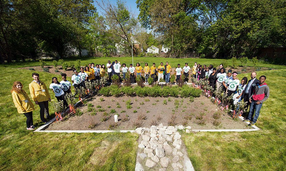Community leaders, project partners and local residents celebrate the installation of a bioretention garden on a vacant lot in Detroit in May 2016. All together, four such gardens were expected to cut stormwater flow by 1.2 million gallons per year, reducing street flooding and water pollution. Image by University of Michigan School for Environment and Sustainability / Flickr. United States, 2020. 