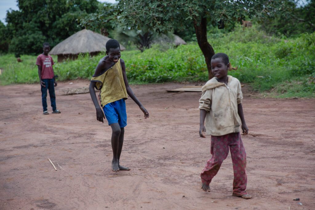 Walter, 16, usually plays at home with his young brother Emmanuel. His condition is stigmatized in the community, and other parents do not allow their children to play with him, afraid they will also contract nodding syndrome. Image by Esther Ruth Mbabazi. Uganda, 2019. 