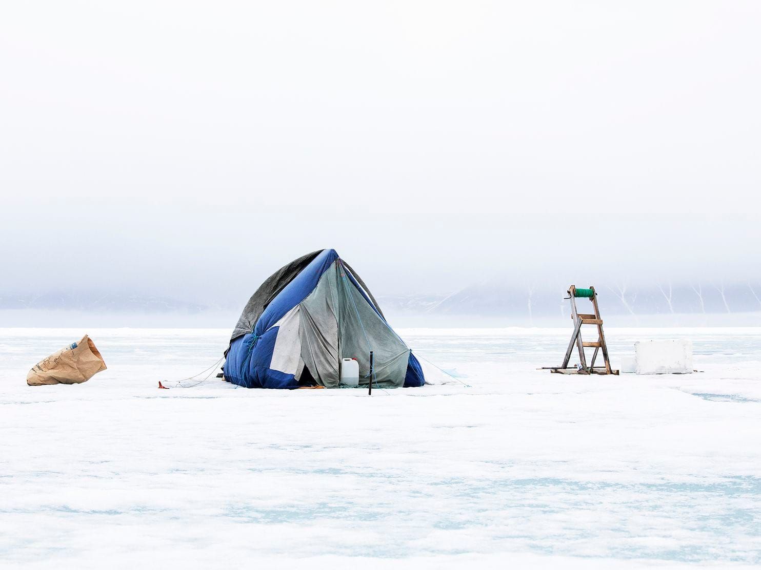 Despite the dangers of the sea ice, some hunters camp out there during the hunting season. Greenland, 2019. Image by Anna Filipova. 