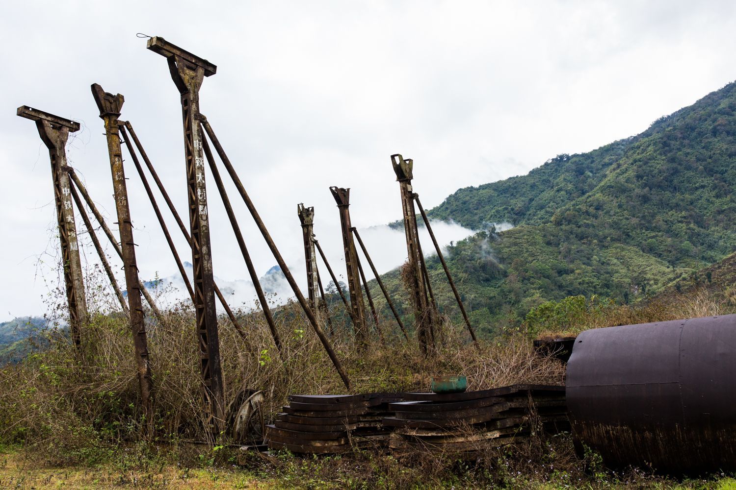 Old and unused materials left by Chinese workers from the Chipwi dam project. The materials were left after fighting resumed in Chipwi, Kachin State, Myanmar. Image by Hkun Lat. Myanmar, 2019.
