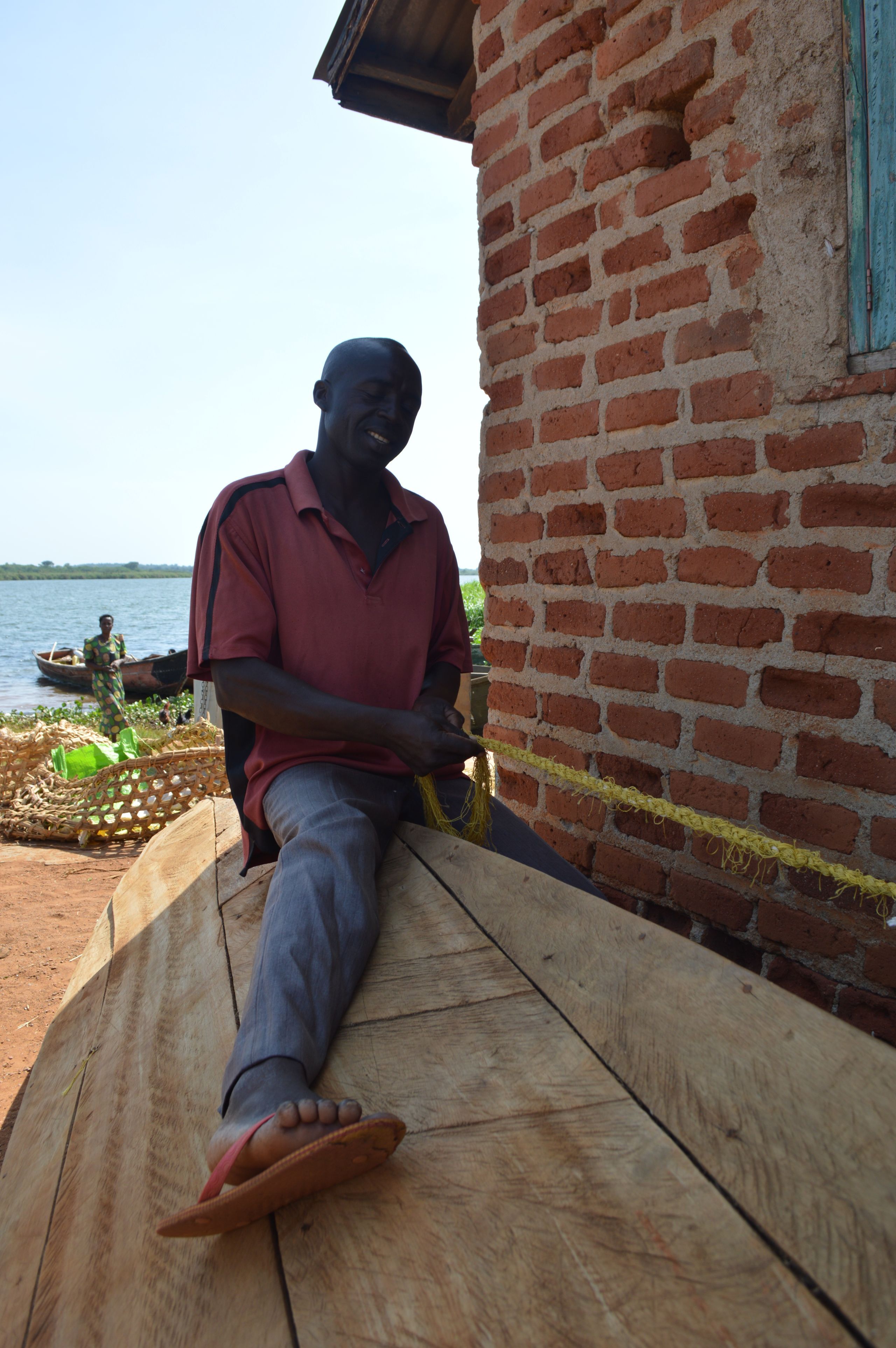 A fisherman working in Walumbe village. When the demarcation of the buffer zone is complete, many Walumbe residents may be made to leave the area, according to NEMA. Image by Annika McGinnis. Uganda, 2019.