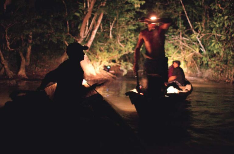Garimpeiros bring diesel, food, engine parts, and other goods up the Sikini Creek to be distributed to illegal gold mines throughout French Guiana. Photo by Narayan Mahon, French Guiana, 2010.