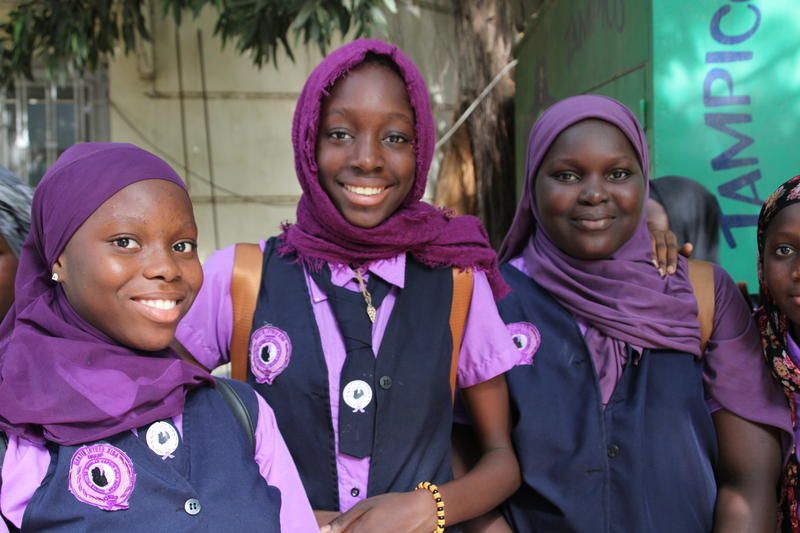 Students from King Middle School welcoming visitors. Image by Michelle Tyrene Johnson. Senegal, 2019.