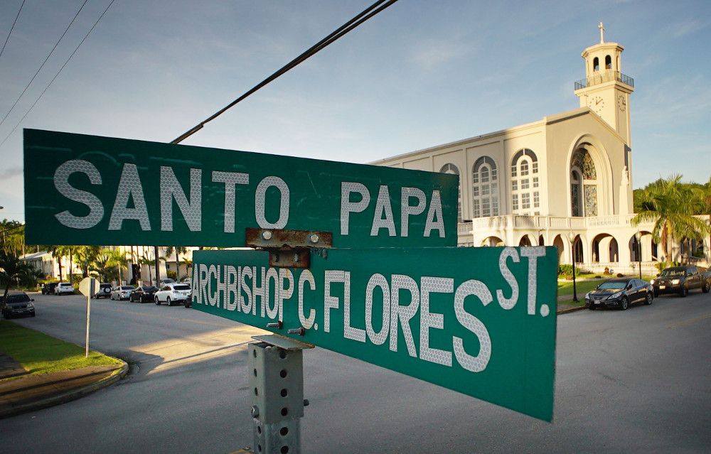 Street signs across from the cathedral on Guam are another indication of just how deeply Catholicism is woven into the fabric of the island. A block away, the office of the attorney for most plaintiffs is located on Martyr Street. Image by Cory Lum. Guam, 2017.