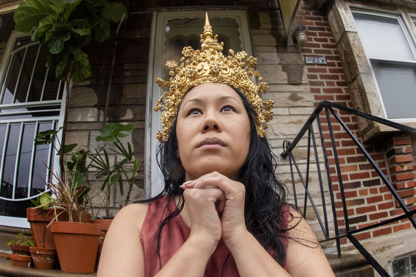 Catzie Vilayphonh is photographed wearing Laos folk crown near her home in Philadelphia, Pa. Friday, May 22, 2020. Vilayphonh, is a poet who runs the community arts group Laos in the House. Image by Jose F. Moreno / The Philadelphia Inquirer. United States, 2020.