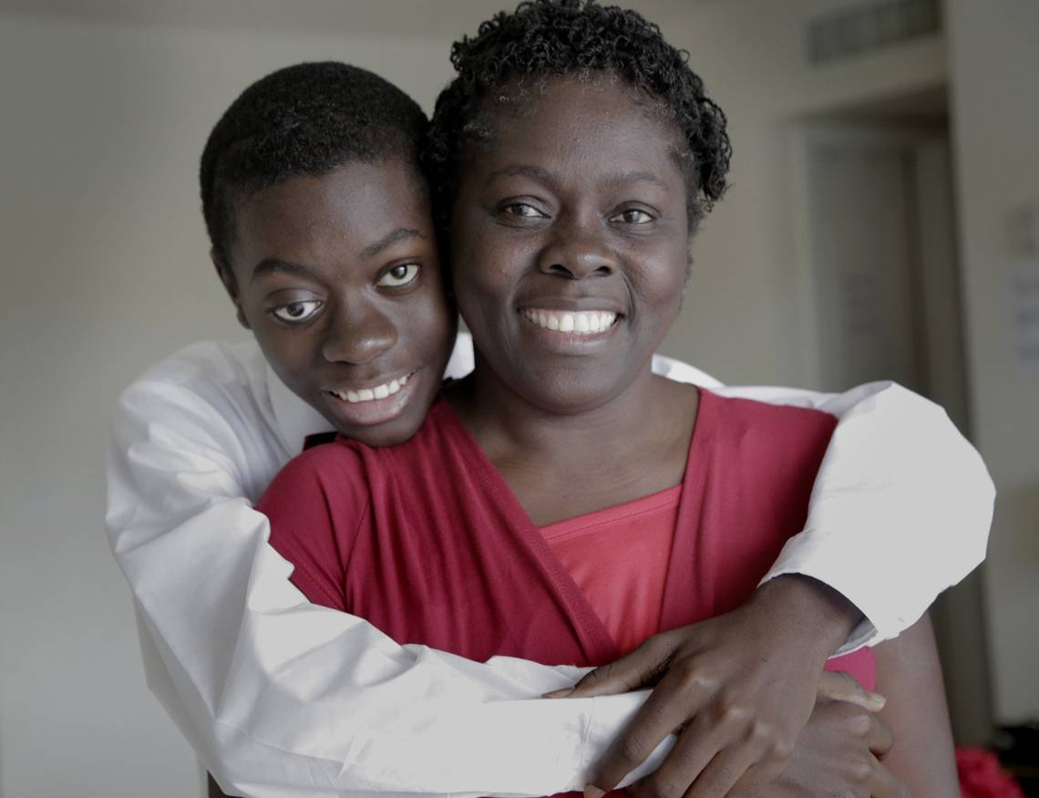 Djonsly Alcin, 14, who is from Haiti, has optic pathway glioma, a slow-growing brain tumor. His mother, Marie Belatrice Louis-Jean’s refusal to give up, helped him find treatment in South Florida. Image by José A. Iglesias. United States, 2018.
