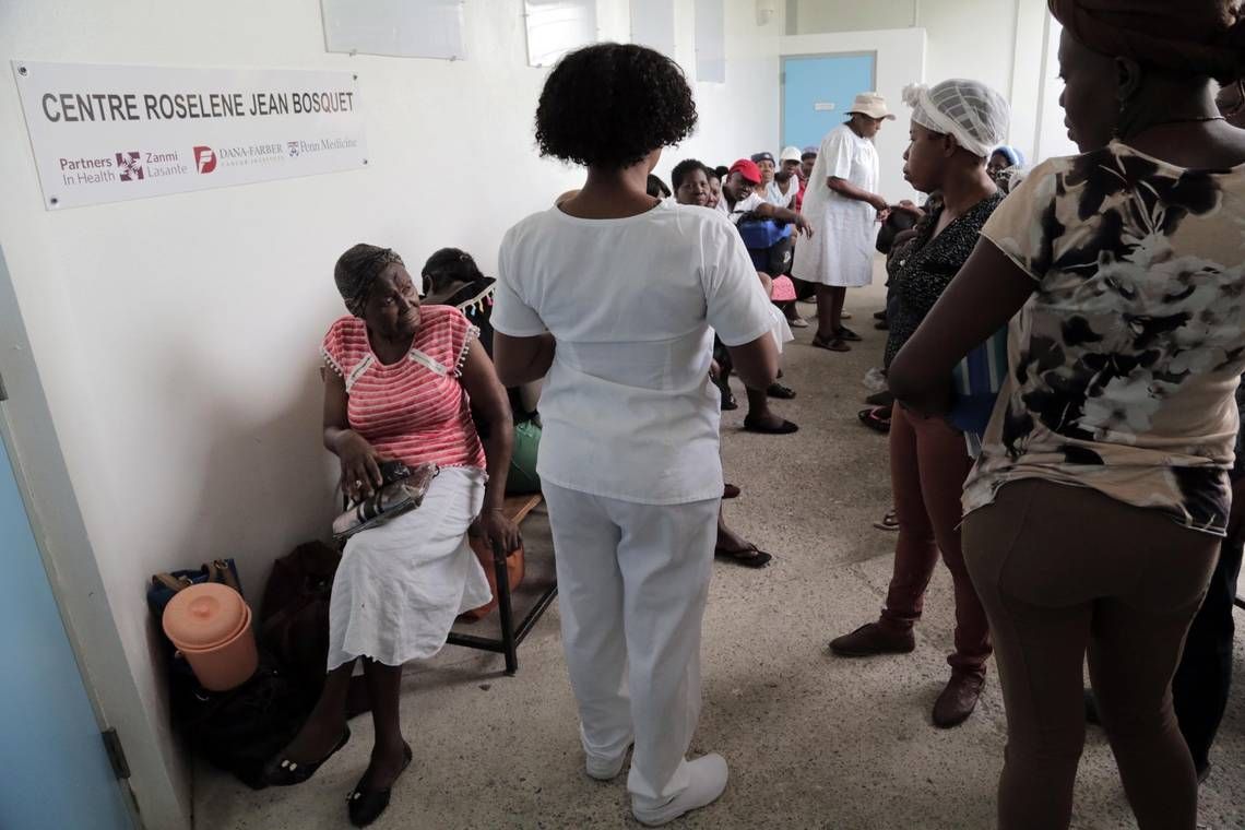 A nurse at the University Hospital of Mirebalais in central Haiti calls out the names of patients who will be getting their chemotherapy treatment. Image by José A. Iglesias. Haiti, 2018.