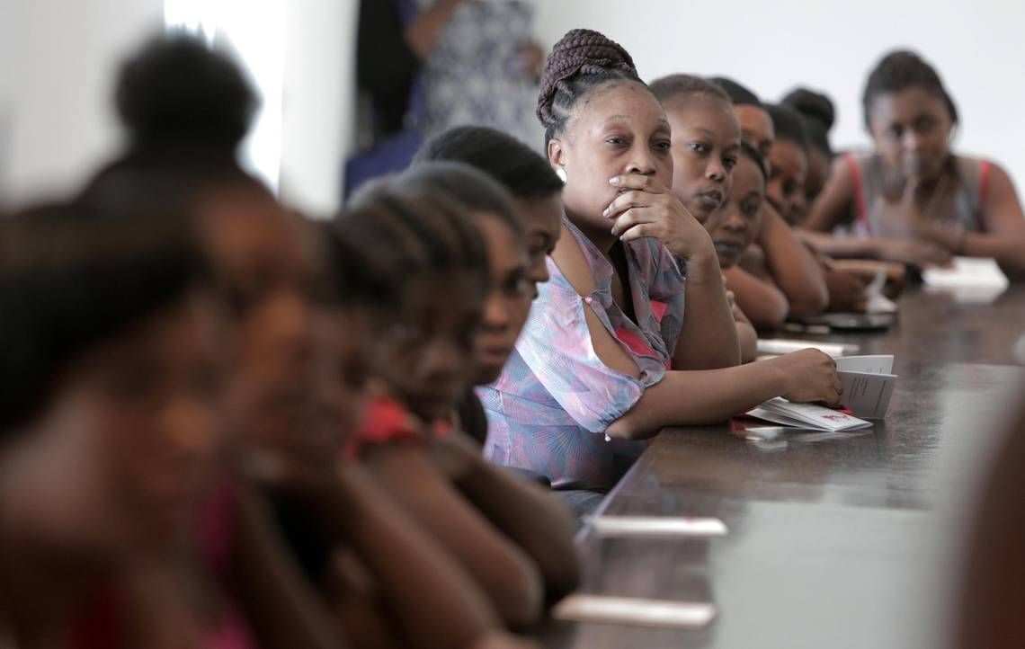 Female factory workers at Cleveland Manufacturing in Port-au-Prince, Haiti attend an informational session on how they can self-collect their own specimen as part of a cervical cancer screening program. Image by José A. Iglesias. United States, 2018.