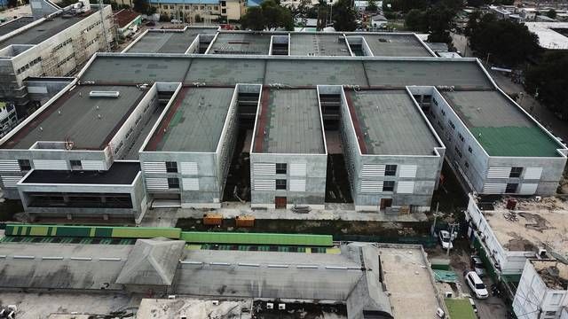 Aerial view of the General Hospital in Port-au-Prince. The sprawling new hospital campus was one of the first projects approved for Haiti’s reconstruction following the earthquake of Jan. 12, 2010. A decade later, the 534-bed teaching hospital has yet to open its doors to a single patient. Image by Jean Marc Hervé Abélard / The Miami Herald. Haiti, 2019.