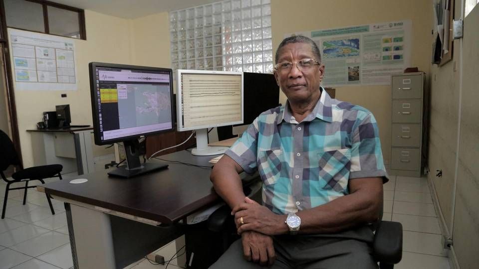 Claude Prépetit sits in an office in the building that houses Haiti’s Bureau of Mines and Energy. This is also where the trained geologist’s seismic team monitors quakes. The building, however, is not earthquake resistant, and there is no budget for people to work through the night or over the weekends. Image by Jose A. Iglesias. Haiti, 2019.