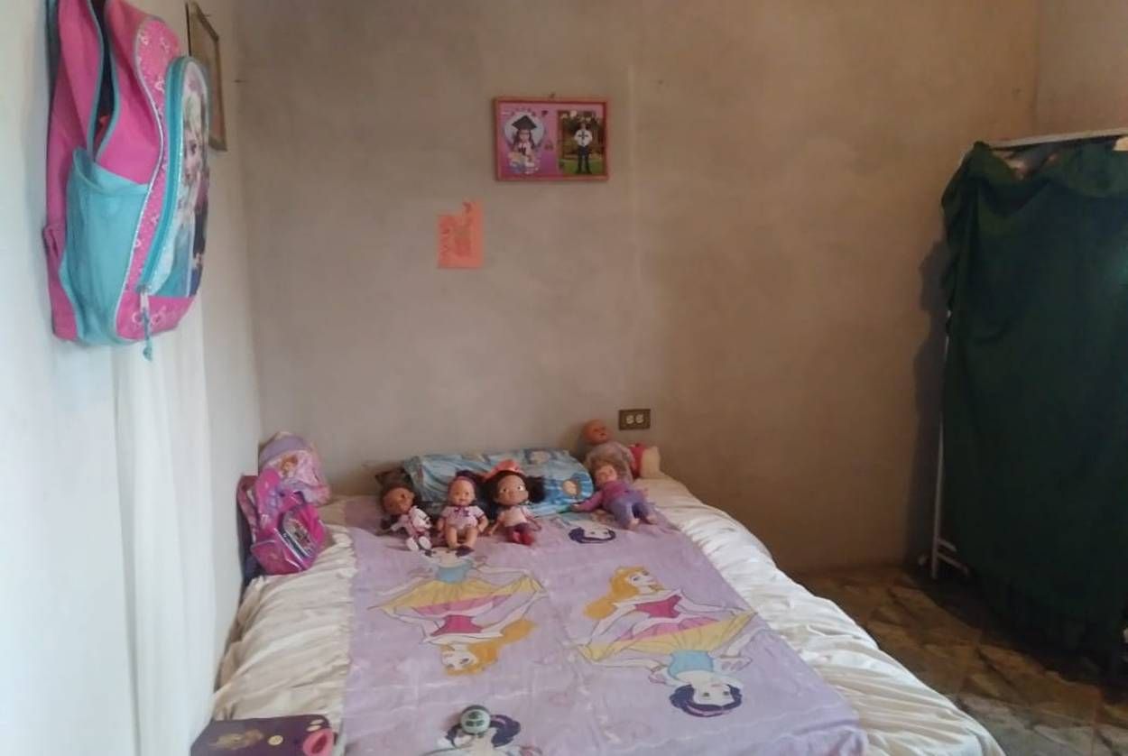 Heyli's bedroom in San Francisco de la Paz, Honduras. Heyli, a first-grader, is learning to read and write, and her mother said she was excited for the trip to the U.S. "My daughter left happy," said Heyli's mother. "She likes to travel a lot." Image by Jay Root. Honduras, 2018.