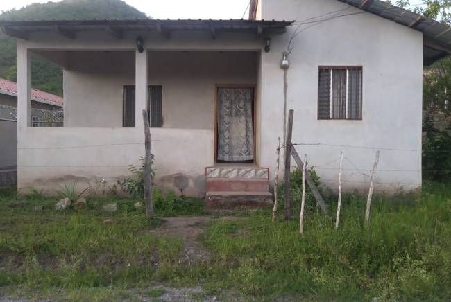 The rental home in San Francisco de la Paz where 6-year-old Heyli lived with her father and mother before setting out for the U.S. on May 15. "Here, you can't live normally," Claudia's mother said of the town. "You can't be out after 6 p.m., 6:30 p.m., 7:00 p.m. ... because they assault you or they will kill you." Image by Jay Root. Honduras, 2018.