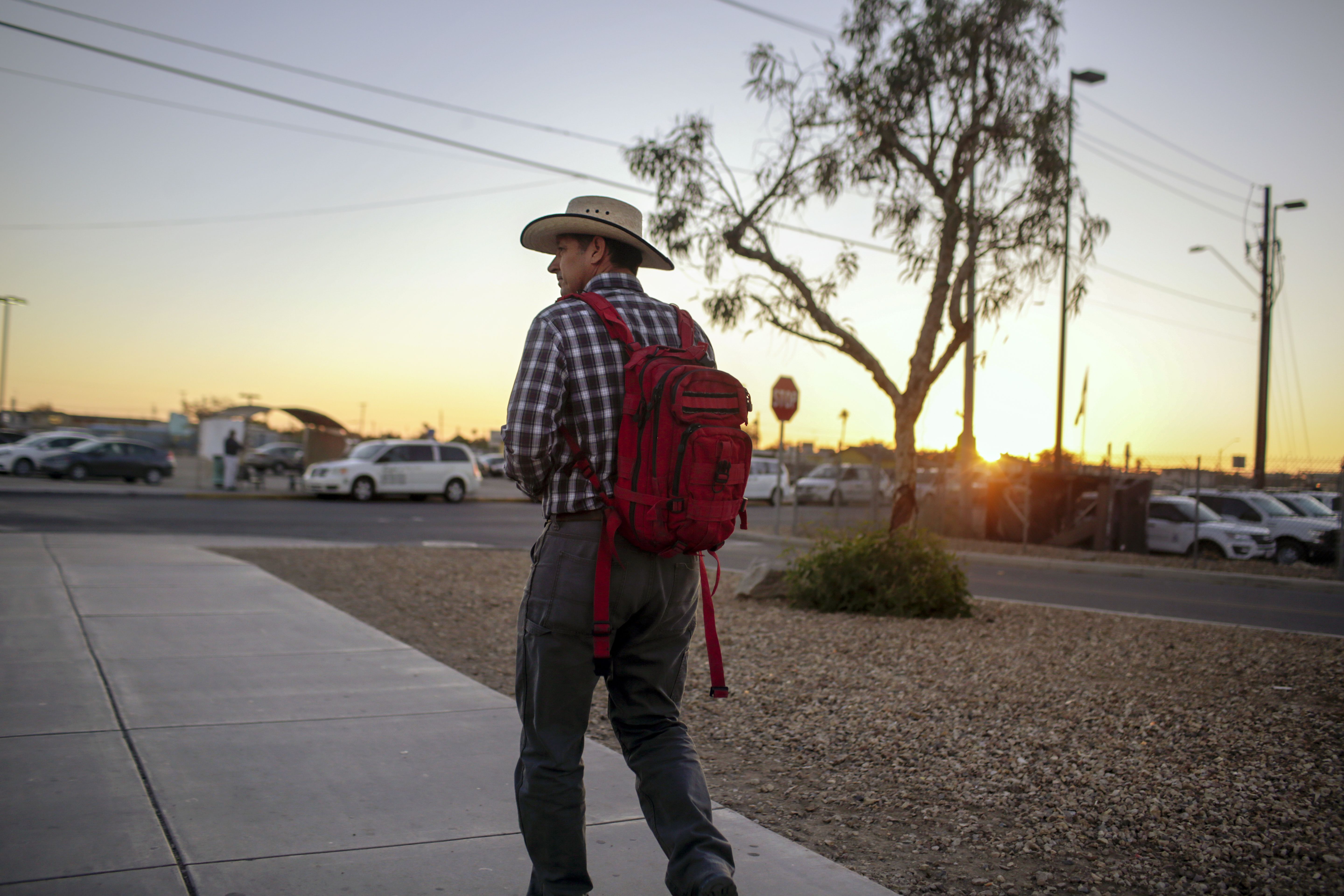 Construction worker Enrique Morales walks to his job after passing through the San Luis port-of-entry in Arizona. Image by Kathleen Flynn. United States, 2019.