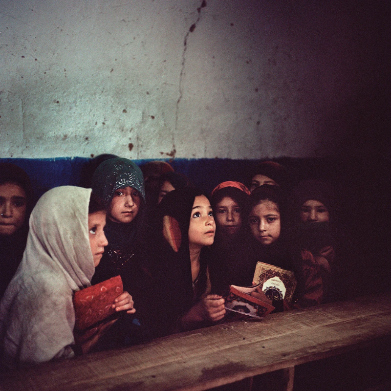 The Koran is taught to young girls at the I-12 settlement. According to the United Nations High Commissioner for Refugees (UNHCR), there is only one government school in I-12, where 71 Afghans and 79 Pakistanis are enrolled. Image by Sara Hylton. Pakistan, 2018.