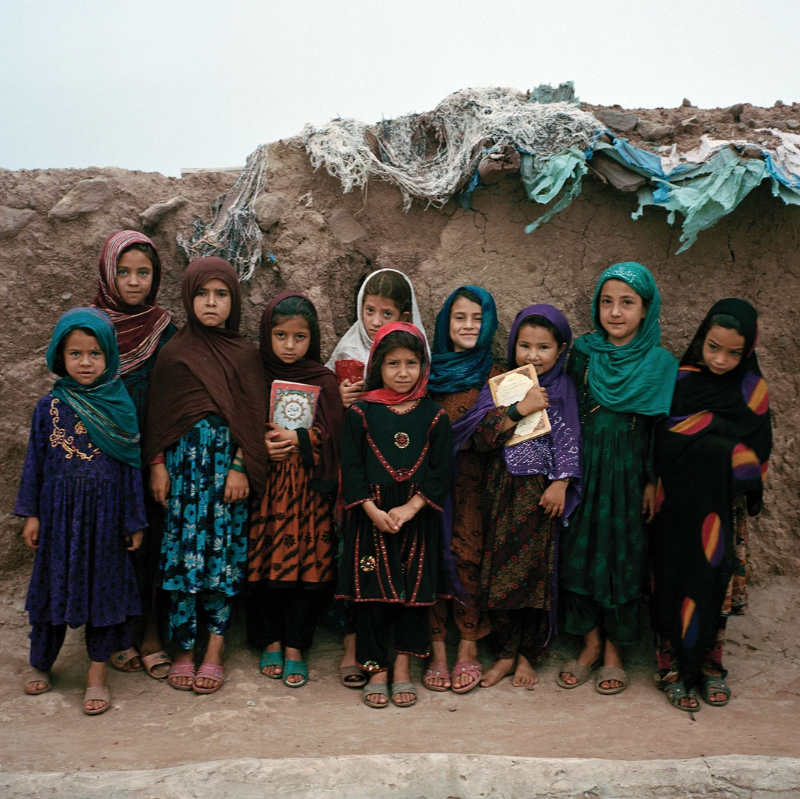 Girls at an Afghan refugee settlement at a madrassa, where they study the Koran. Image by Sara Hylton. Pakistan, 2018.
