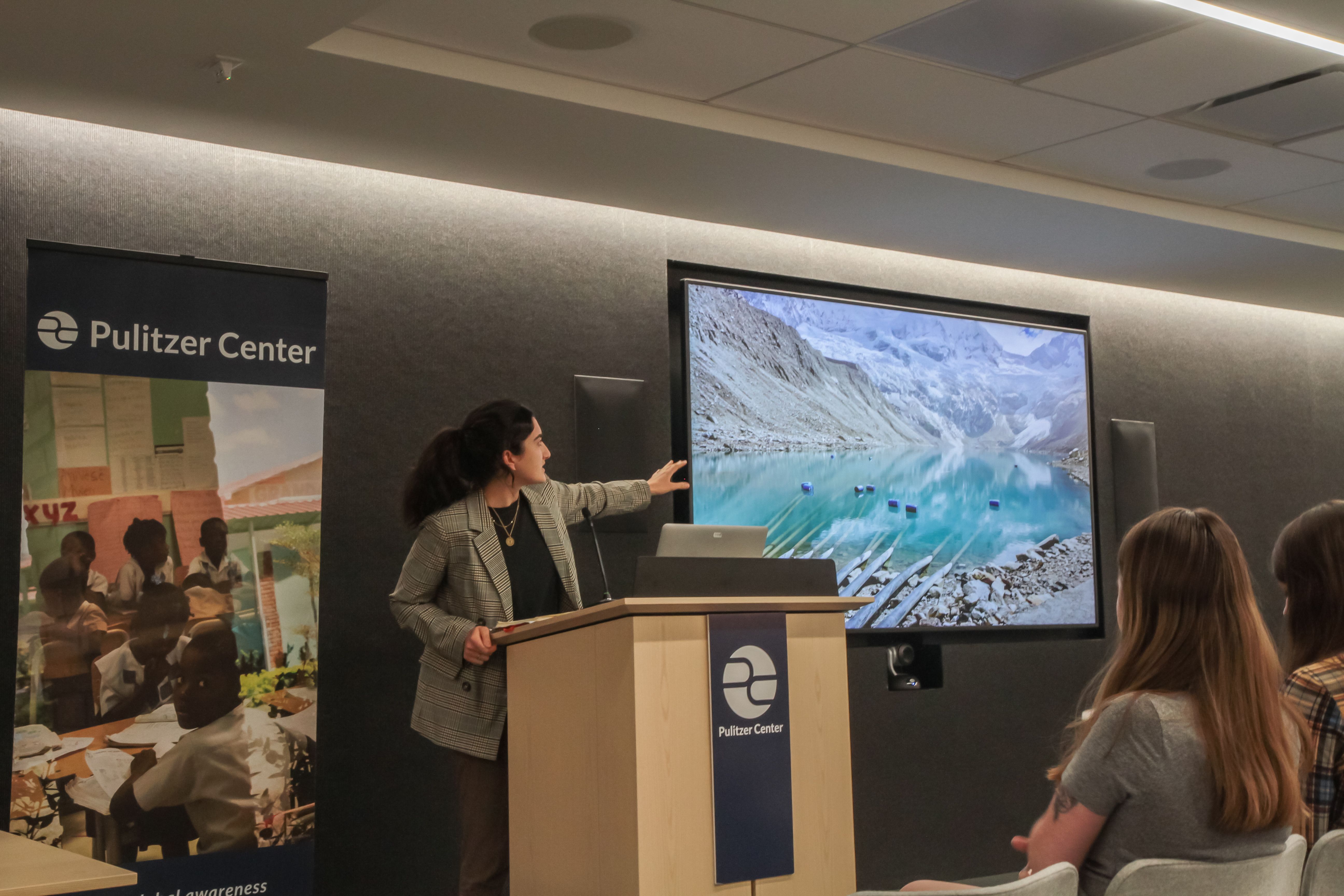 Audrey Fromson from the University of Chicago discusses climate change threats in Huaraz, Peru. Image by Libby Moeller. United States, 2019.