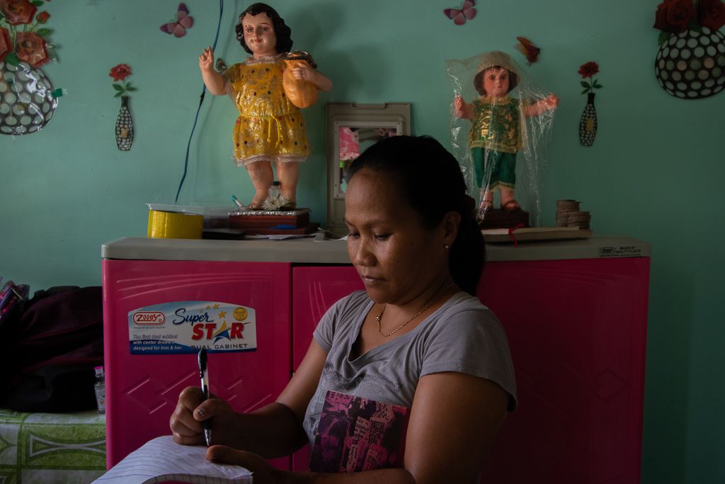 Quillo says living in Summer Homes requires a lot of patience, but her family is adjusting well. They moved there a year ago from Estero de Magdalena. Image by Micah Castelo. Philippines, 2019.